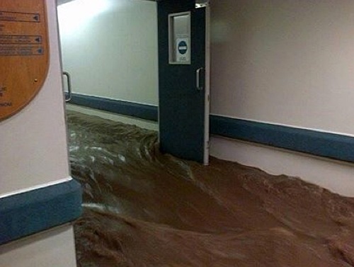 Stormwater surges down a passage at Vergelegen Mediclinic at the height of the devastating storm on the night of 15 November 2013.